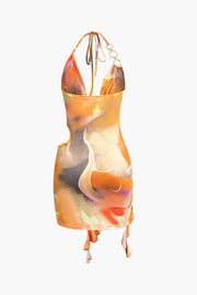 Mira | Asymmetrischer Seitenschlitz Neckholder-Minikleid mit Kunstdruck