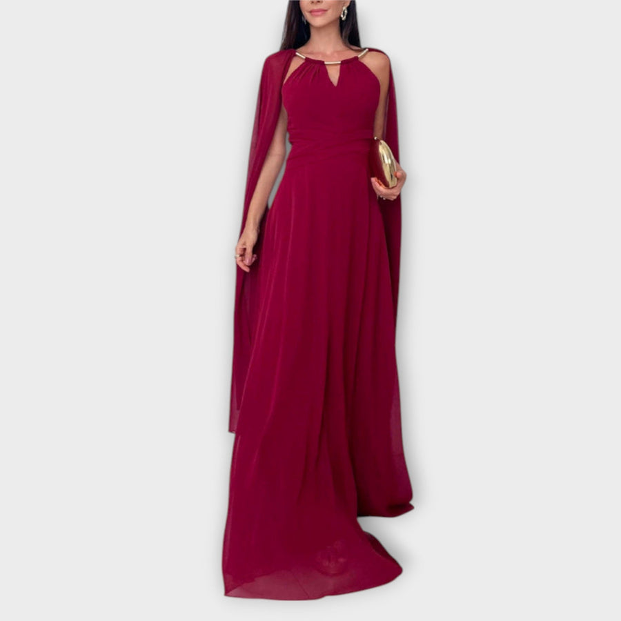 Mabel - Elegantes Maxikleid mit Cape-Ärmeln und hohem Schlitz" 

Rewritten: "Mabel - Stilvolles Maxikleid mit schwingenden Cape-Ärmeln und verführerischem Schlitz