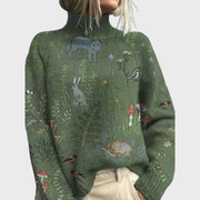 HANA | GEMÜTLICHER STRICKPULLOVER MIT WALDMOTIV