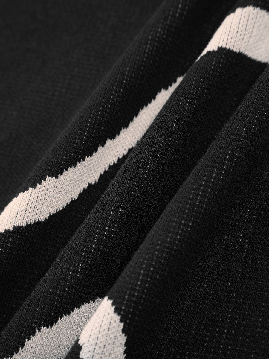 Maisie | Figurschmeichelndes Midikleid mit abstraktem Muster und zarten Spaghettiträgern
