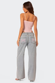 Verity | Hochbundjeans mit Schleifen-Detail in Signature-Design