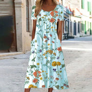 Eloise – Maxikleid im Bohemian-Stil mit Blumenmuster und Taschen | Kurzärmliges Maxikleid mit Blumenmuster im Boho-Chic-Stil für Damen