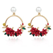 Florale Ohrringe in Loop-Form mit Perle