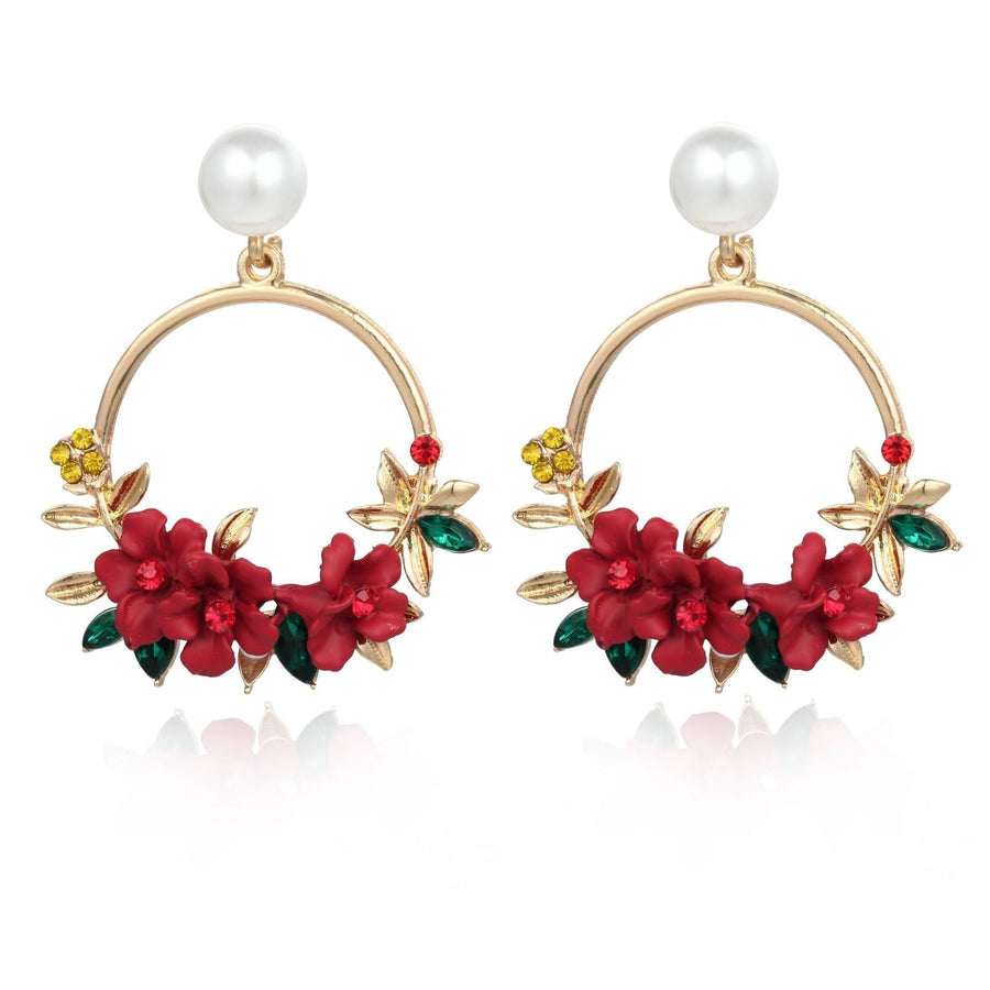 Florale Ohrringe in Loop-Form mit Perle