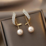 Perlenohrringe in Gold mit Glitzerelement