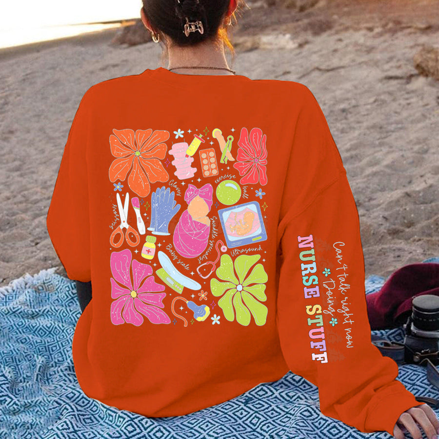 Damen Sweatshirt mit buntem Grafikdesign und originellem Pflege-Motiv