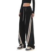 Damen nan weite Jogginghose mit hoher Taille und Jeansstoffeinsätzen sowie Seitenstreifen Drune