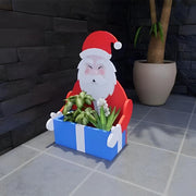 Blumentopf im Weihnachtsmann-Design
