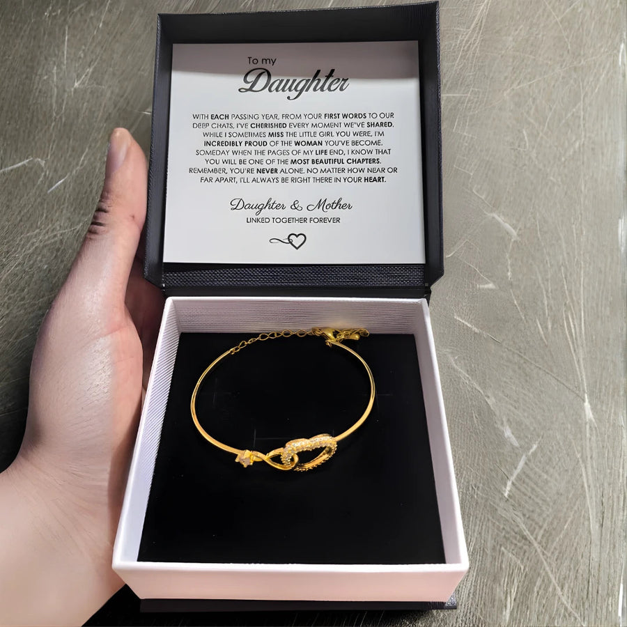 Infinito | Bracciale madre-figlia in oro bianco e oro