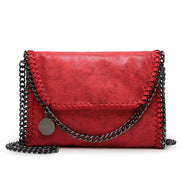Elegante Wildleder-Clutch mit trendiger Kettenapplikation