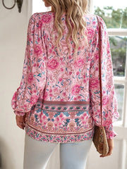Damenbluse mit Blumenmuster und langen Puffärmeln