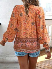 Damenbluse mit Blumenmuster und langen Puffärmeln