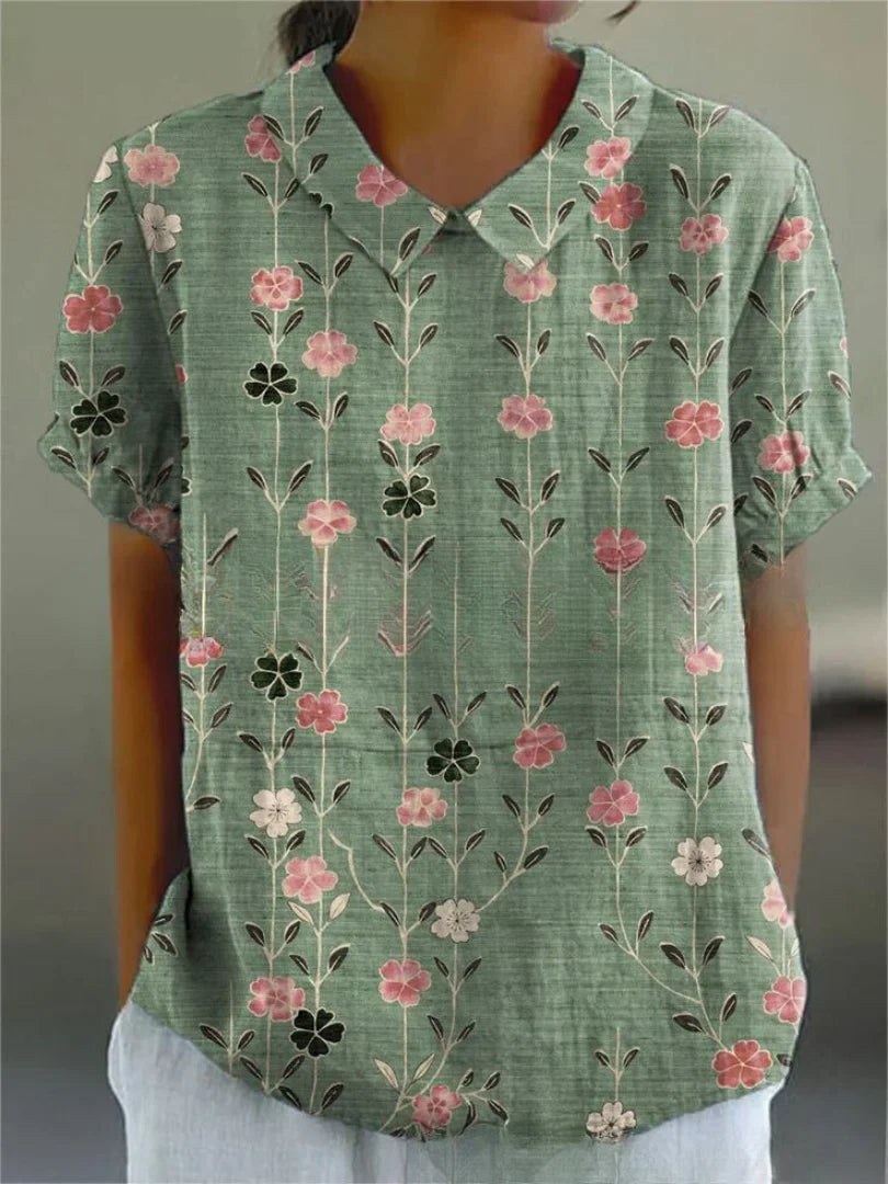 Damen Polo mit floralem Stickmuster und kurzen Ärmeln