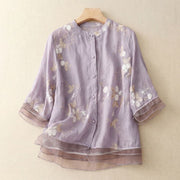 Damen Bluse mit Knopfleiste, Rundhalsausschnitt und floraler Struktur