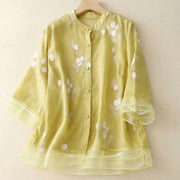 Damen Bluse mit Knopfleiste, Rundhalsausschnitt und floraler Struktur