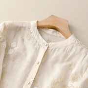 Damen Bluse mit Knopfleiste, Rundhalsausschnitt und floraler Struktur