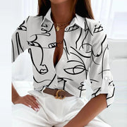 Damen Bluse mit Umlegekragen und grafischem Muster