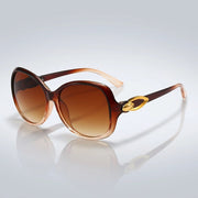 Damen-Sonnenbrille mit Schmetterlingsform und Metallic-Akzenten