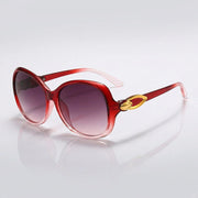 Damen-Sonnenbrille mit Schmetterlingsform und Metallic-Akzenten