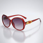 Damen-Sonnenbrille mit Schmetterlingsform und Metallic-Akzenten