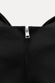 Damen-Top mit Schleifendetail und Glitzer-Struktur
