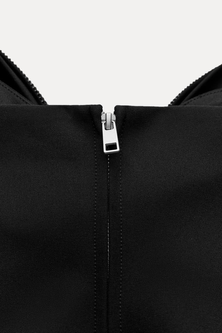 Damen-Top mit Schleifendetail und Glitzer-Struktur
