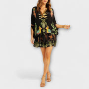 Linda - Elegantes Kleid mit asymmetrischen Schultern und Kokosnussbaum-Muster