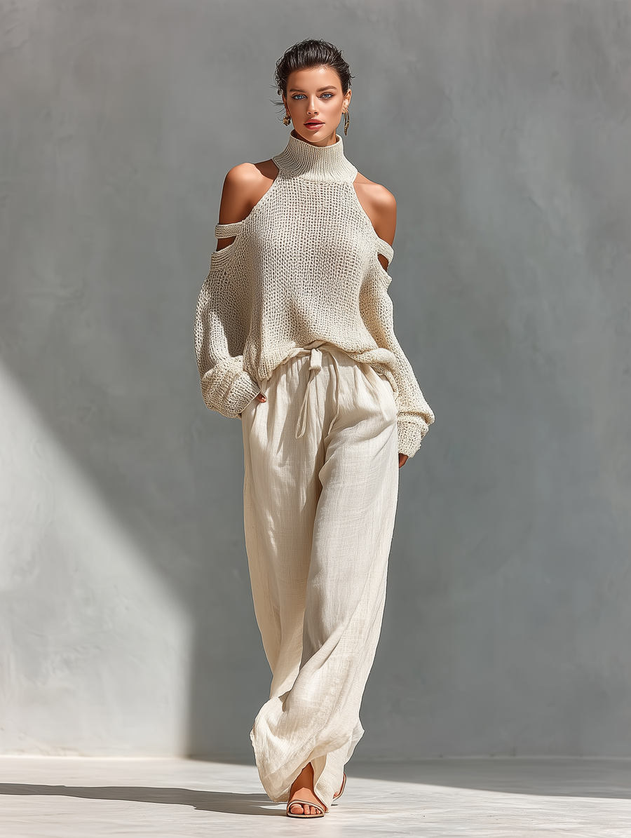 Set aus einem gestrickten Damen-Rollkragenpullover mit Cold-Shoulder-Ausschnitt und einer Hose mit weitem Bein