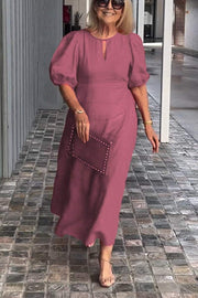 "Natalia | Zeitloses Eleganzkleid" could be rewritten as "Natalia | Klassisches Eleganzkleid".