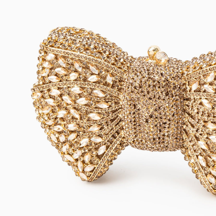 Loulou | Goldene Clutch in Schleifenform mit Kristallbesatz – Glitzernde Abendtasche für Damen mit Magnetverschluss